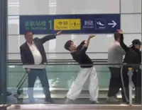 Video of Chinese uncle joining dancers on walkway with funny pose gains 10 million views