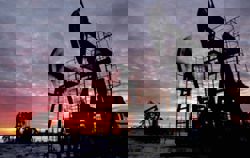 Oil settles lower after biggest annual loss since 2020