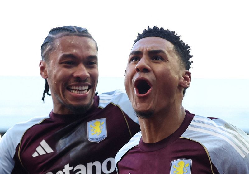 Soccer-Villa surge into second, Wolves finally win in Premier League