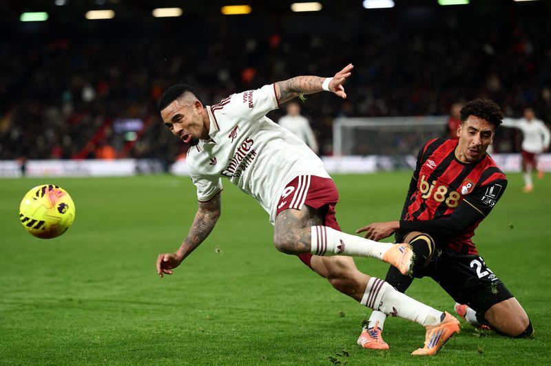 Soccer-Rice double at Bournemouth puts Arsenal six points clear