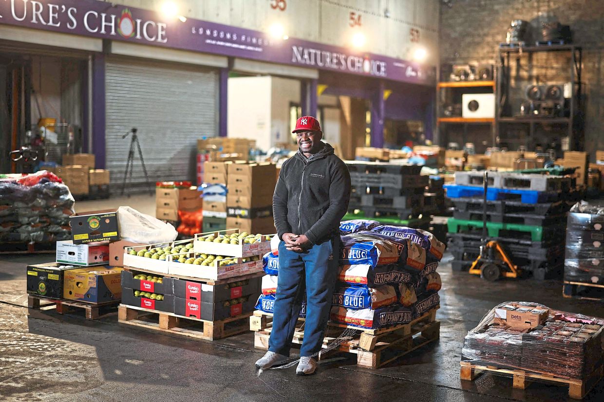 Cristovao working at the warehouse.