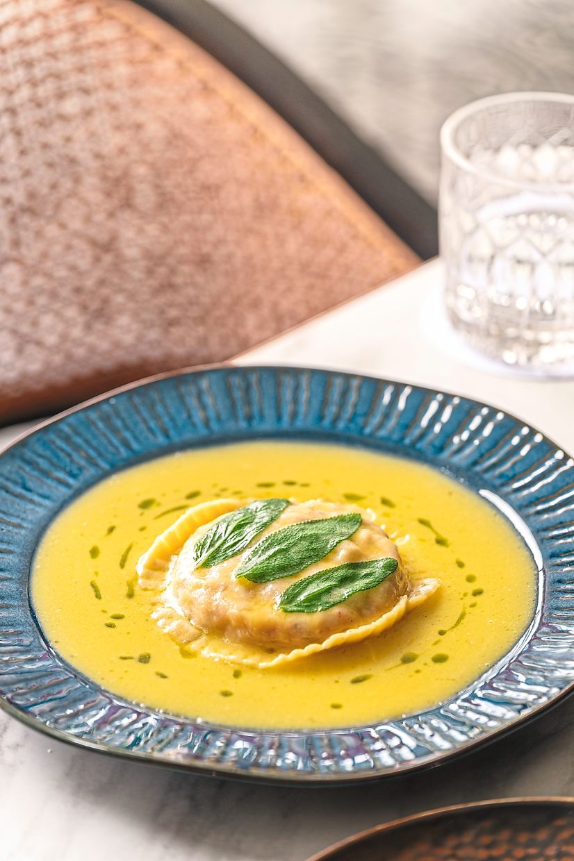 Stuffed with lobster, the raviolo is enhanced by a hedonistic sage butter sauce.