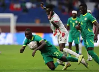 Soccer-Senegal first to book place in Cup of Nations quarter-finals