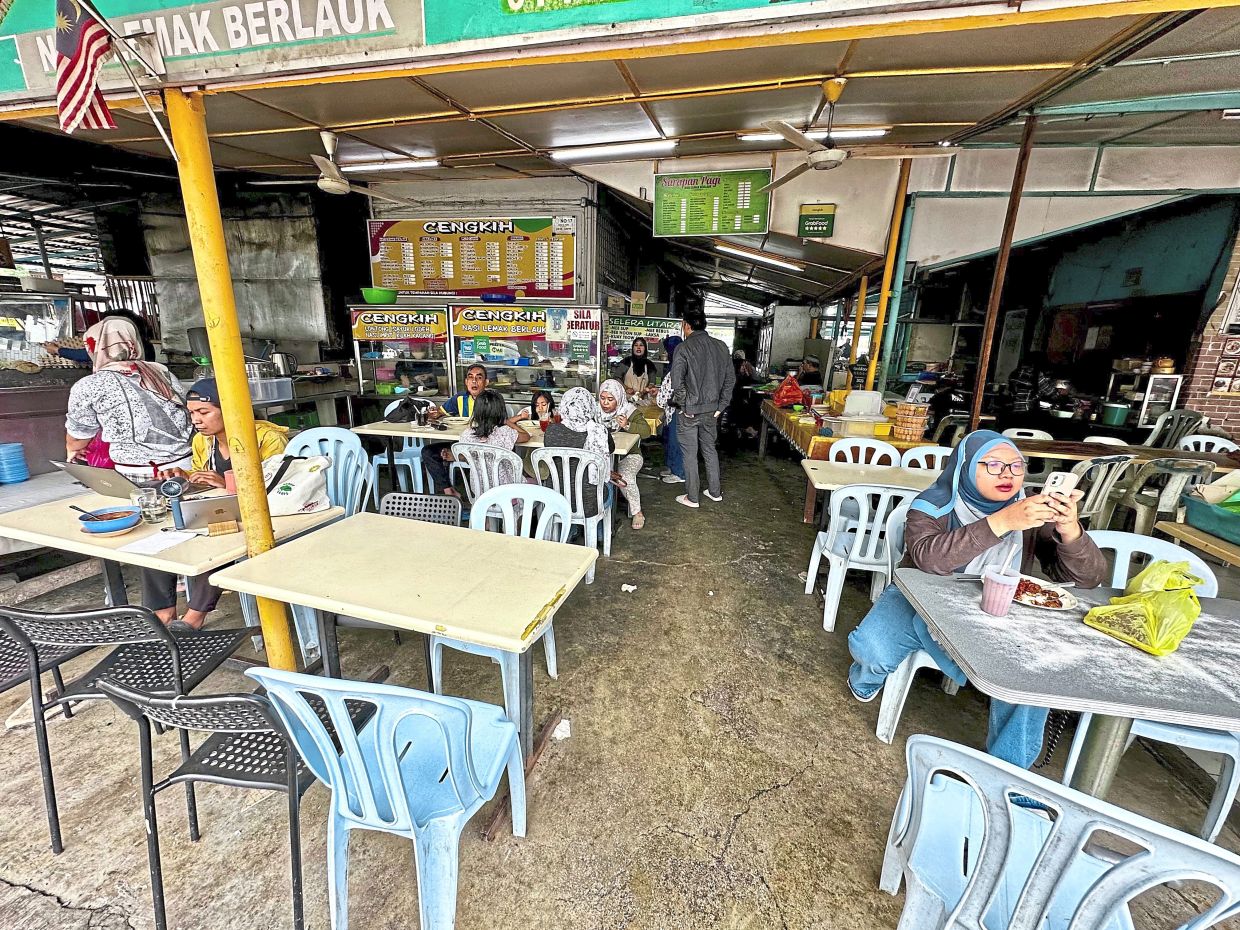 The Medan Selera Lama Taman Melawati is visibly run down, with worn flooring, faded paint and ageing fixtures.