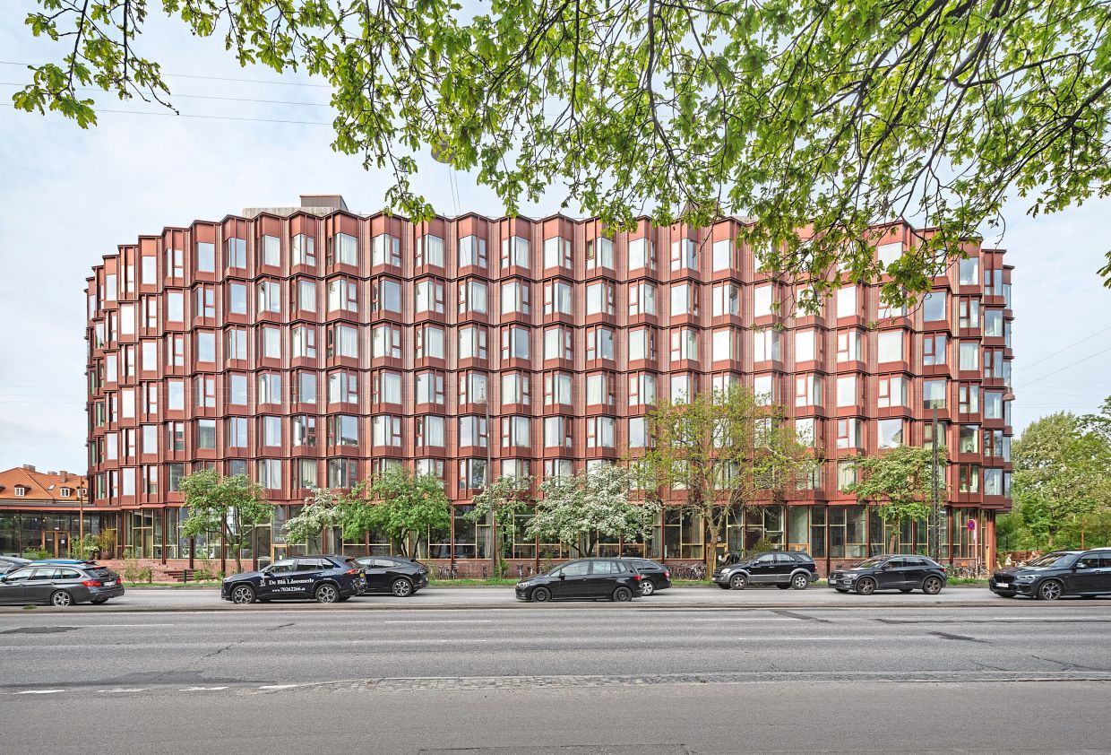 Compact housing project in Copenhagen redefines 'micro-living' with bay windows