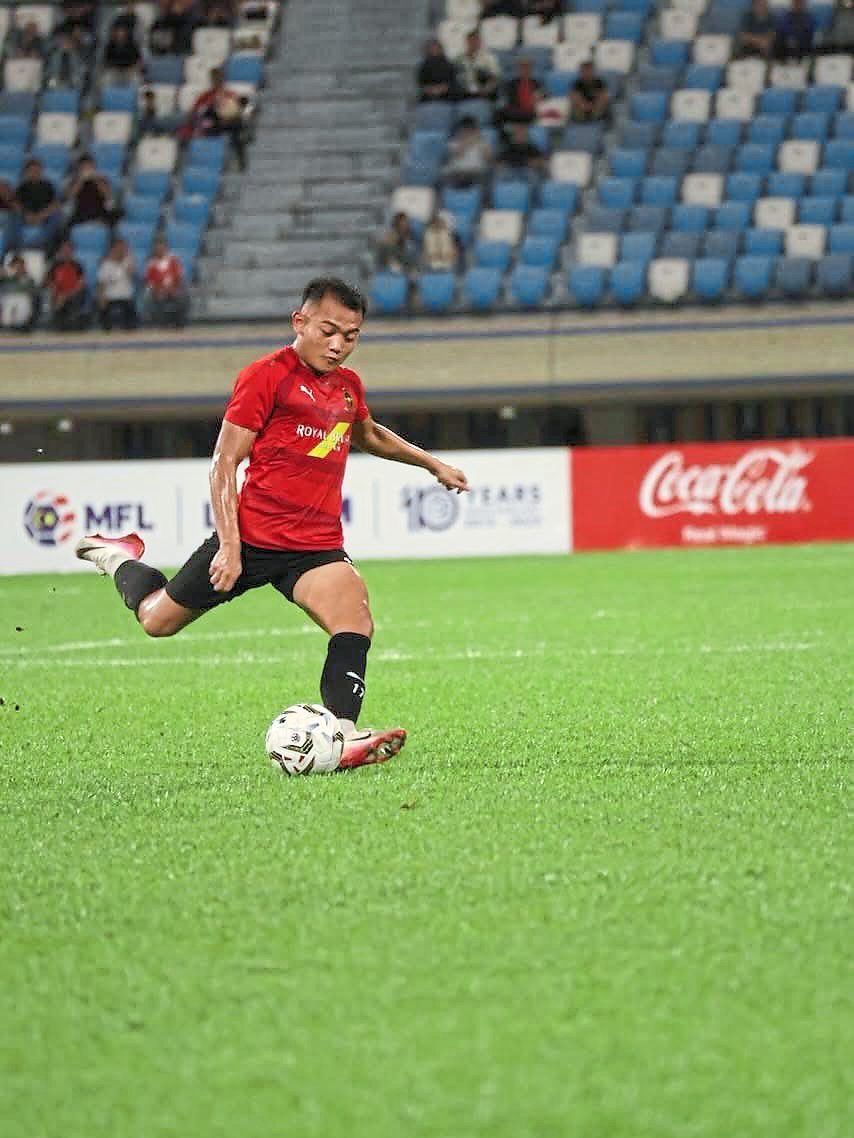 Gem from Brunei: Hakeme Yazid Said kicks the ball during their game against Police. — DPMM FC