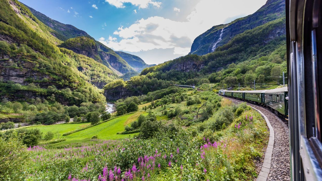 Take in Norway's breathtaking countryside onboard the world-famous Flam Railway, passing majestic mountains and cascading waterfalls.