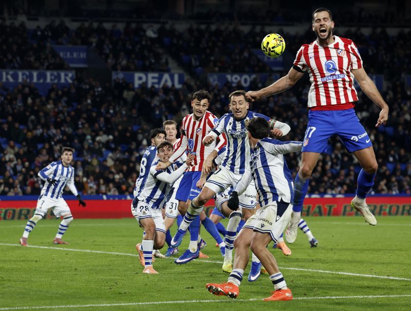 Soccer-Atletico and Real Sociedad share spoils after lively 1-1 draw