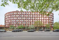 Compact housing project in Copenhagen redefines 'micro-living' with bay windows