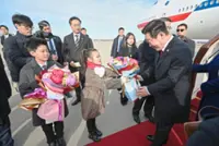 Missiles fly as Lee begins China visit