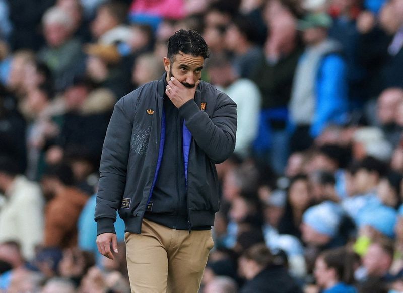 Soccer-Man United fans torn over sacking of Amorim