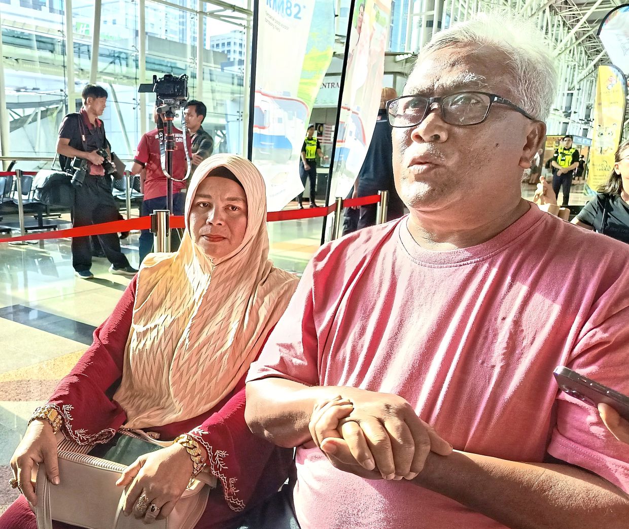 Halim and Noor Aini waiting patiently at JB Sentral to board the Southern Express train for the last time.