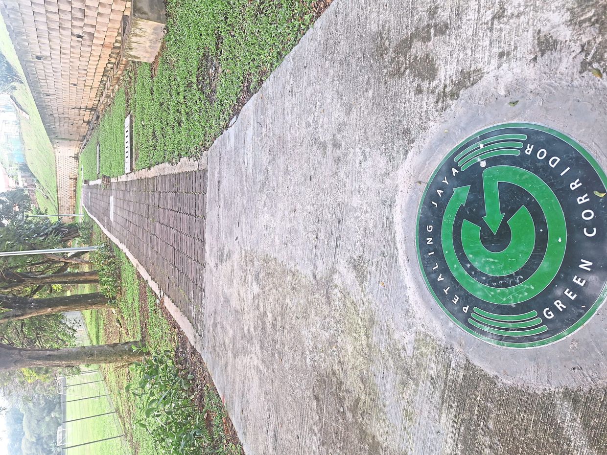 Set in concrete on the walking path leading to Taman Aman.