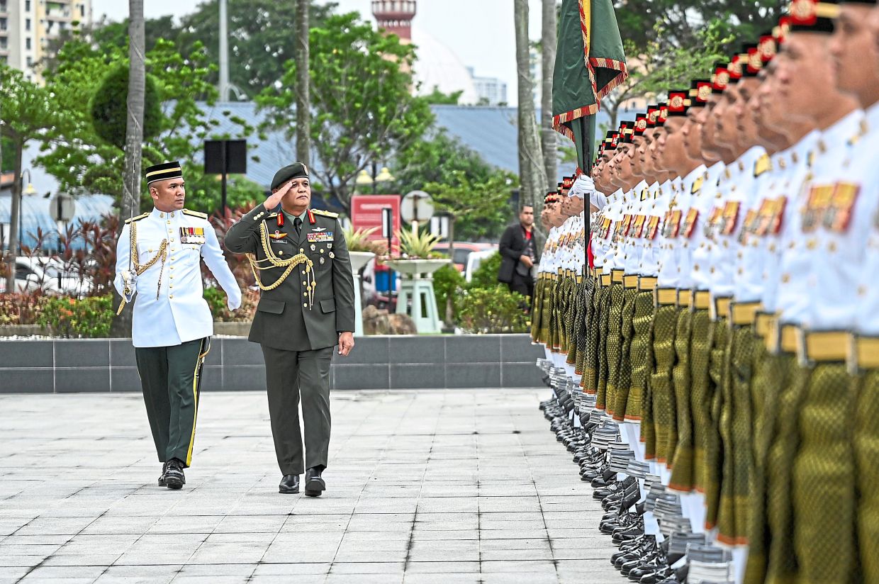 Highest honour: Azhan inspecting the main guard of honour during the 31st Army Commander’s parade at Wisma Pertahanan Square.