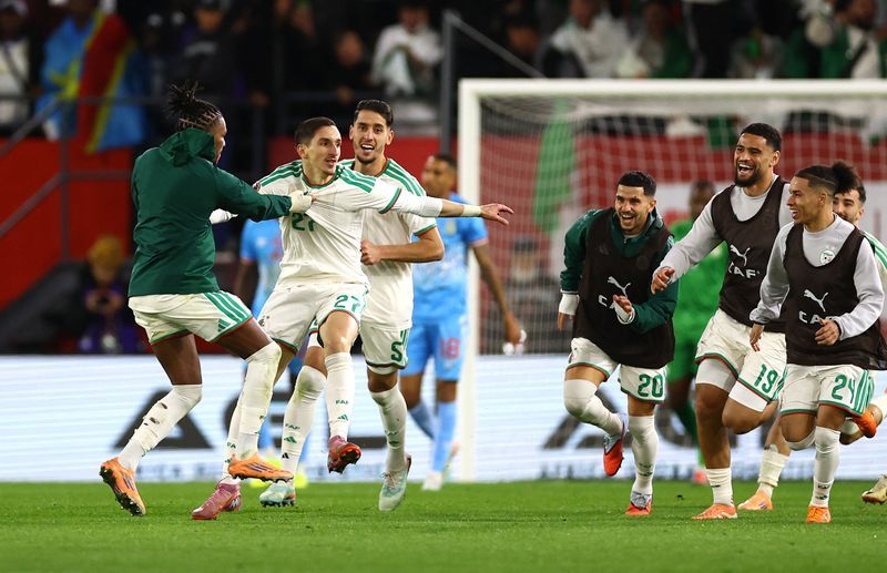 Soccer-Dramatic late winner puts Algeria into Cup of Nations last eight
