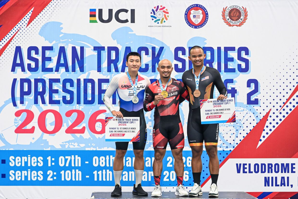 Still got it: Cyclist Azizulhasni Awang poses with other riders after winning at the President's Cup in Nilai - his first tournament at home after a year. - Bernama