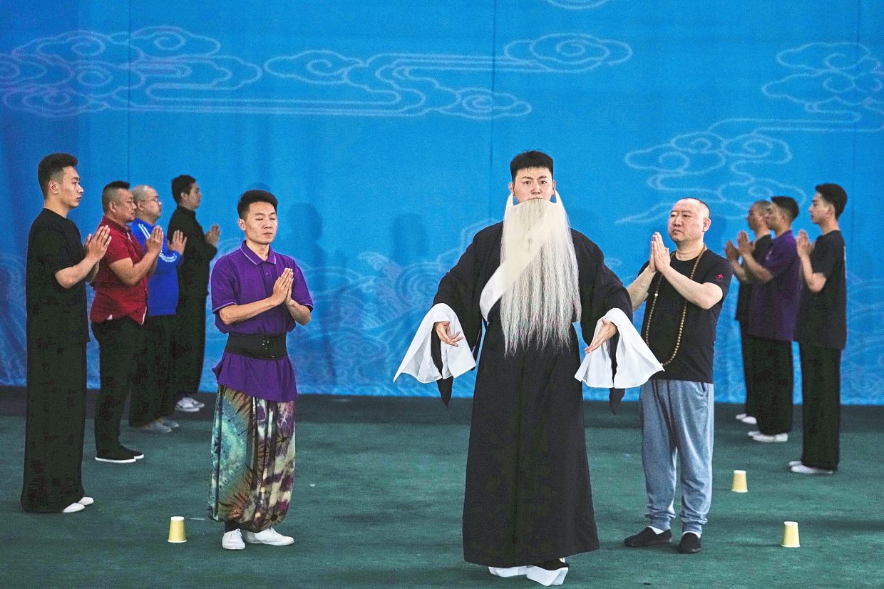 Peking opera actors rehearse a newly written play at the Jingju Theatre Company in Beijing. Photo: AP