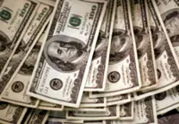Dollar on the defensive as traders await key US economic data