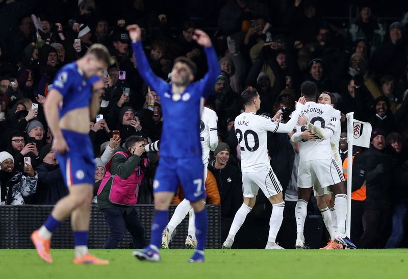 Soccer-Ten-man Chelsea suffer defeat at neighbours Fulham