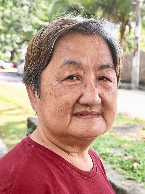 Tan fears tripping on pothole-riddled Jalan 1 on her daily walks.