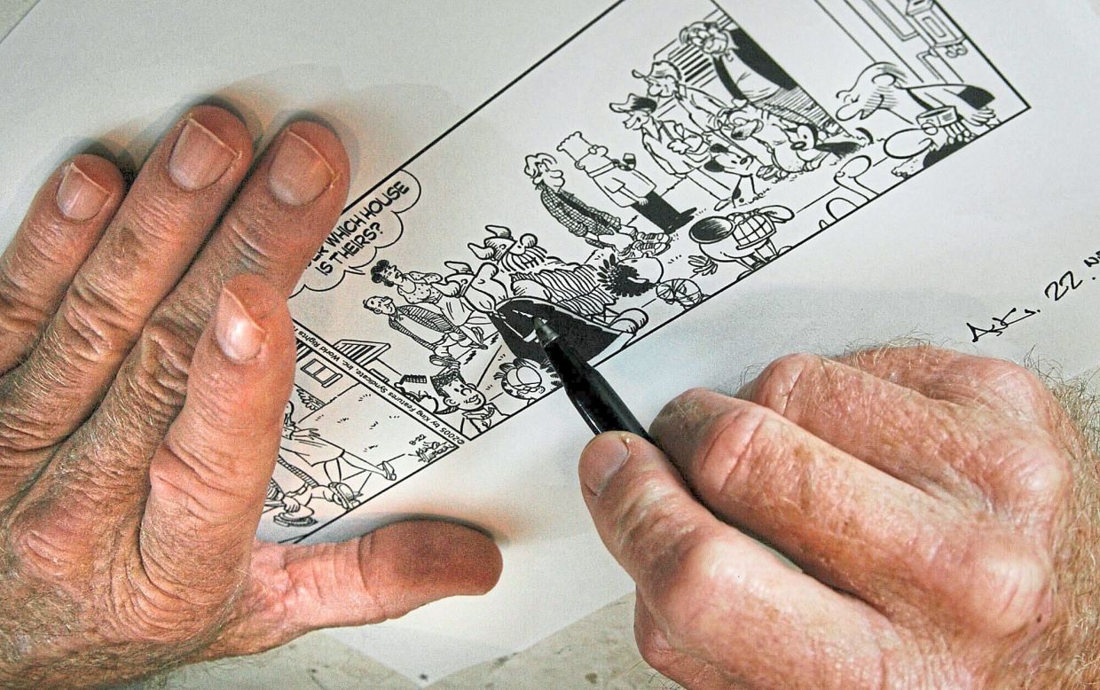 Dean Young, writer of the 'Blondie' comic strip, draws in his studio in Clearwater, Florida in 2005.