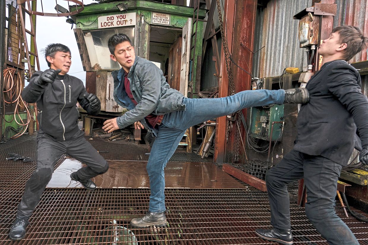The silat master (centre) is the leading man in Wu Assassins.