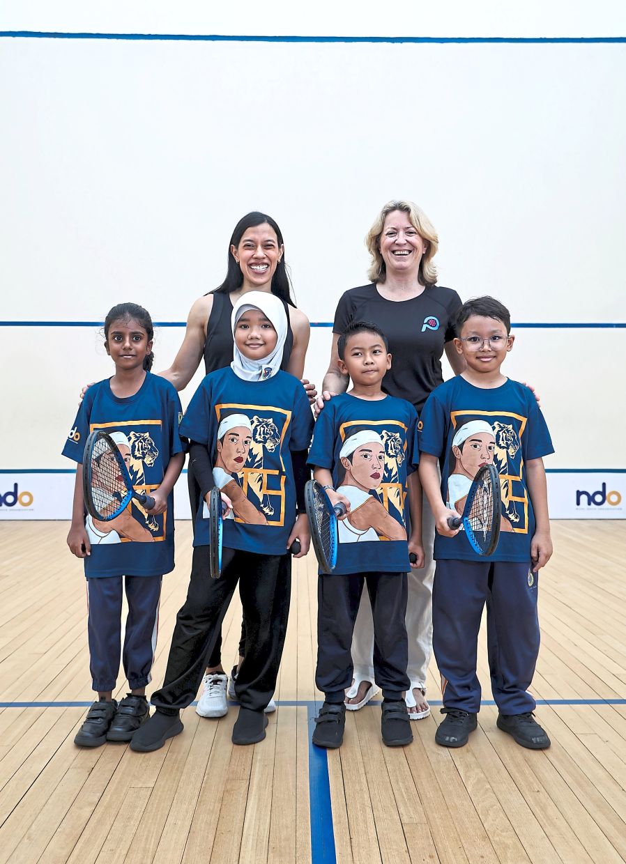 Through teamwork, children learn boundaries and mutual respect, says Nicol (back row, left), pictured with Irving and students from the Little Leagues Programme.