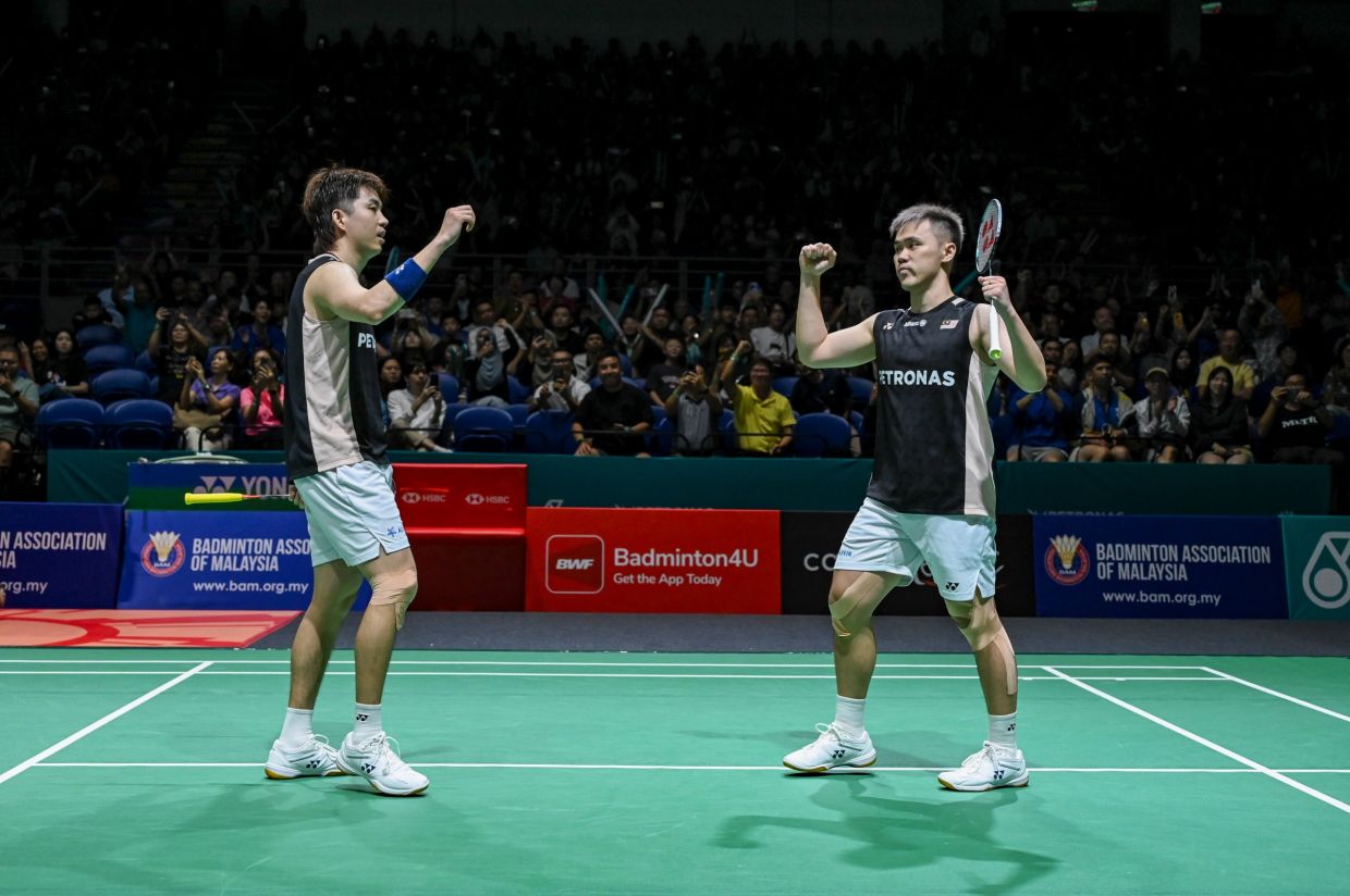 Malaysia men’s doubles shuttlers Man Wei Chong-Tee Kai Wun celebrate after winning. — IZZRAFIQ ALIAS/The Star