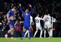 Soccer-Ten-man Chelsea suffer defeat at neighbours Fulham