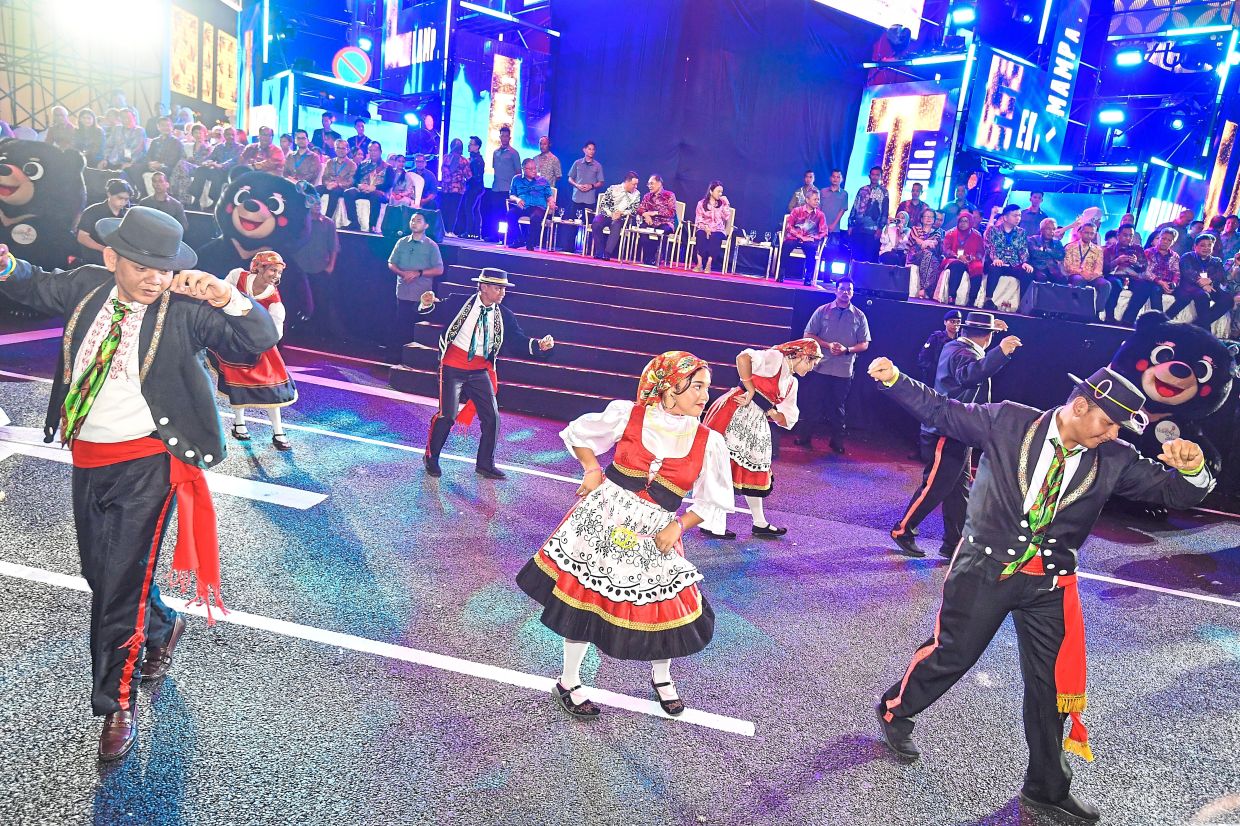 The Portuguese community showcases their culture during the festival parade. — IZZRAFIQ ALIAS/The Star