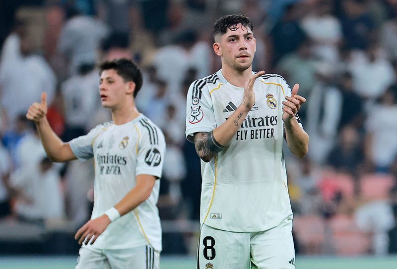 Soccer-Real Madrid edge Atletico 2-1 to set up Clasico in Super Cup final