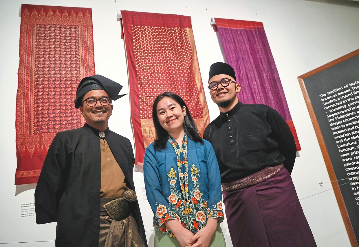 Curators (from left) Izuan, Yeoh, and Hariz say the exhibition highlights the stories behind the Malay costumes, textiles and accessories.
