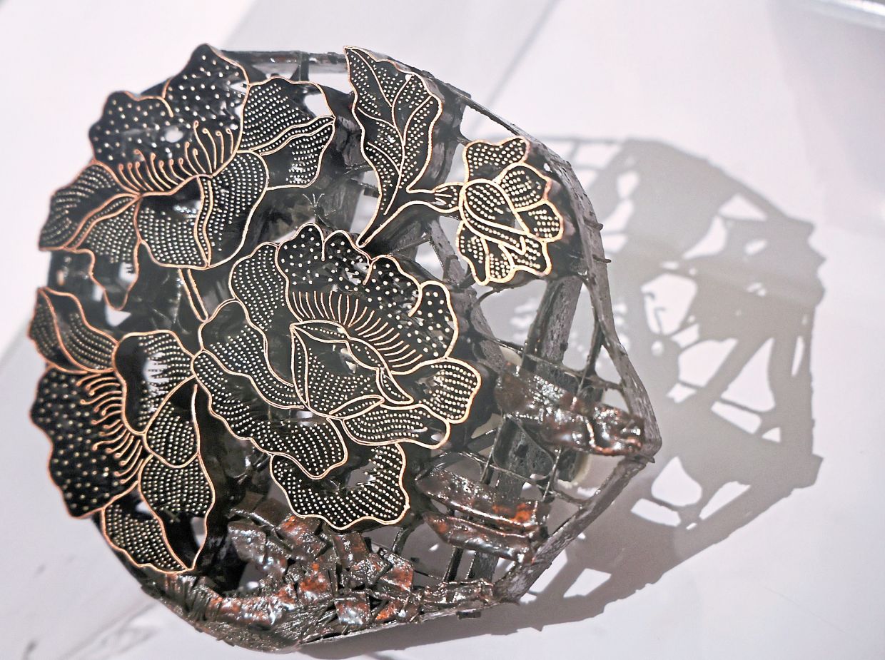 The batik cop, or batik terap, uses copper stamps to create motifs efficiently and consistently.