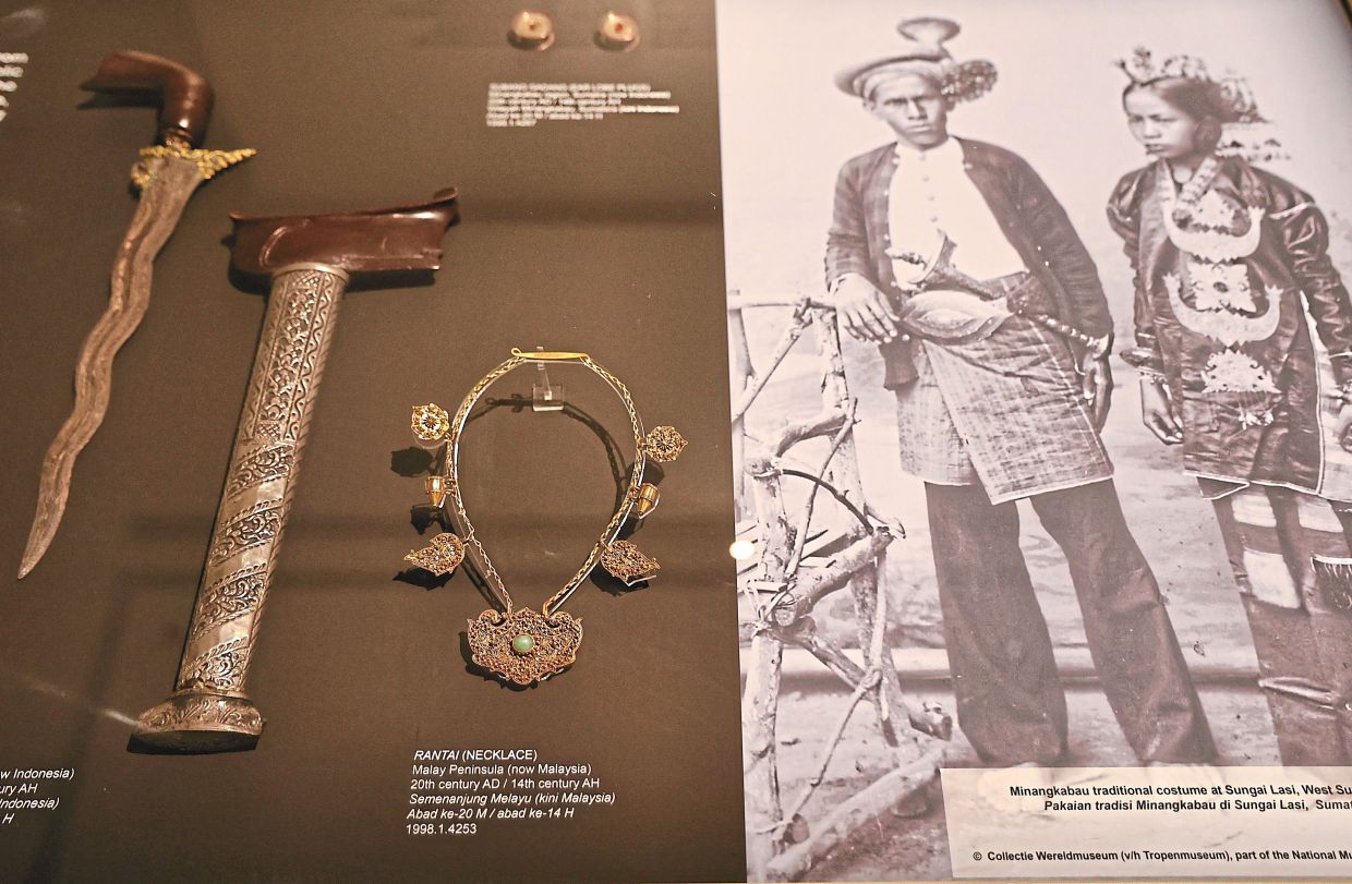 Shown here are a keris (left), holster, and necklace, traditional accessories of the Minangkabau, whose roots trace back to West Sumatra, Indonesia.
