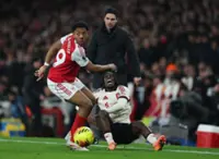 Soccer-Lacklustre Arsenal held to dour 0-0 draw by Liverpool