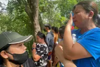 One dead and dozens of people missing after Philippine dump site collapse