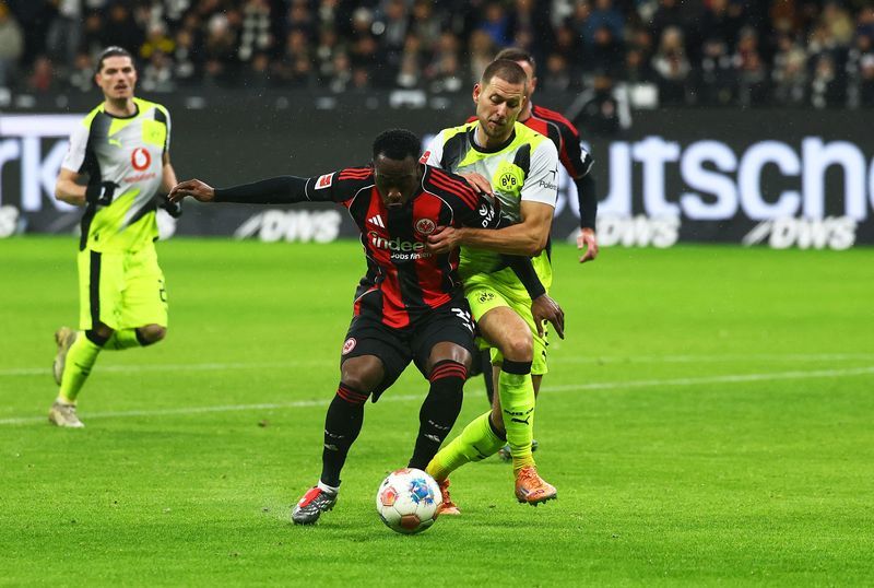 Soccer-Dortmund twice waste lead but grab last-gasp equaliser for 3-3 draw at Frankfurt