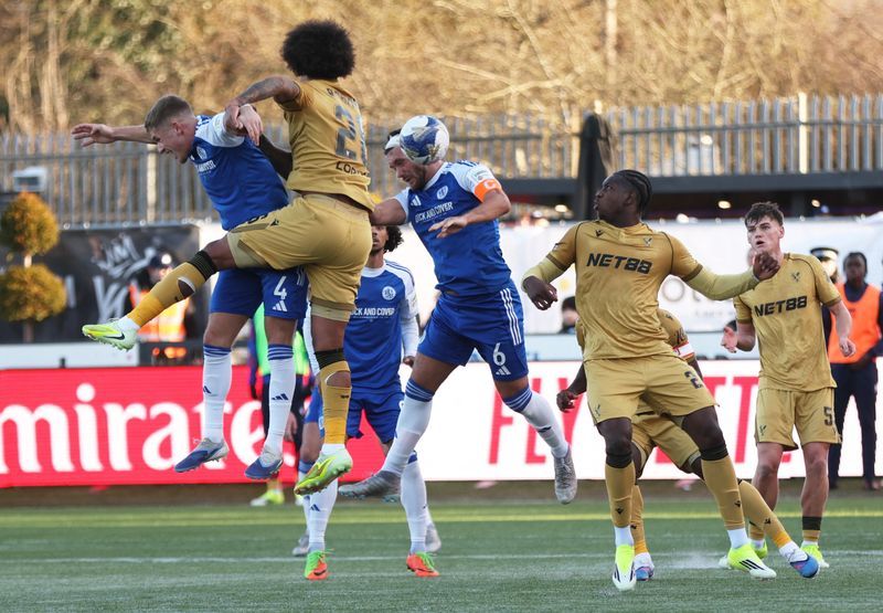 Soccer-FA Cup holders Palace knocked out by non-league Macclesfield