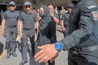 Man denies IED charges from hospital bed