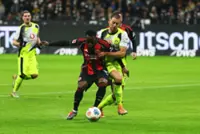 Soccer-Dortmund twice waste lead but grab last-gasp equaliser for 3-3 draw at Frankfurt