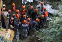 Two dead, dozens missing after Philippine dump site collapse