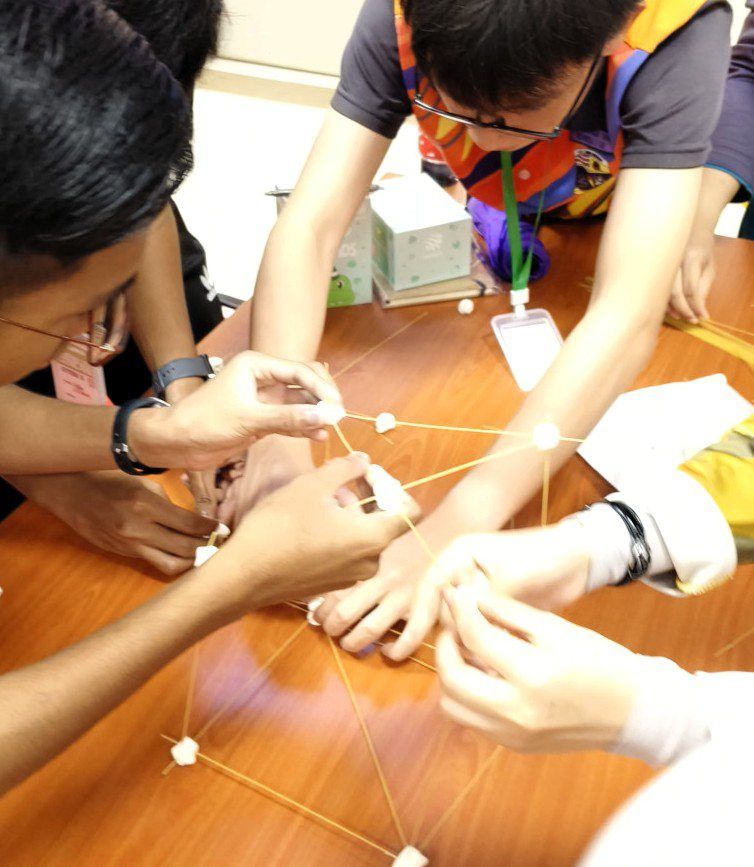 Attentive: Students engaging in interactive activities at a station.