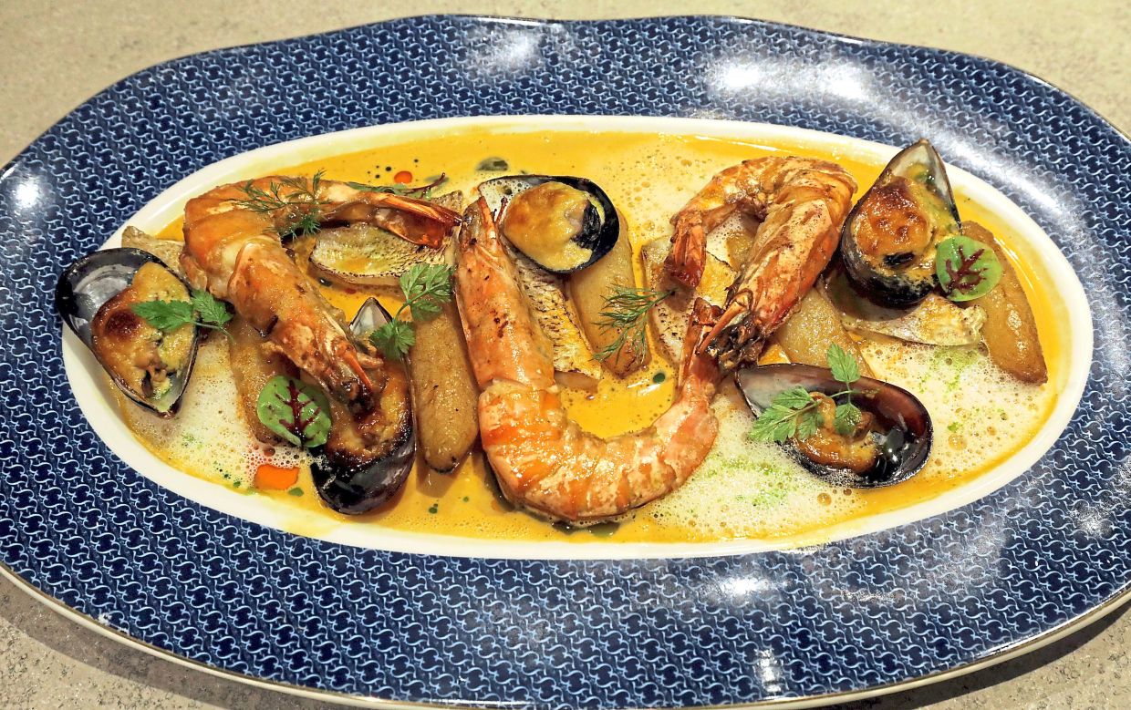 The classic French bouillabaise is an aquatic stronghold bolstered by red mullet, mussels and tiger prawns.— SAMUEL ONG/The Star