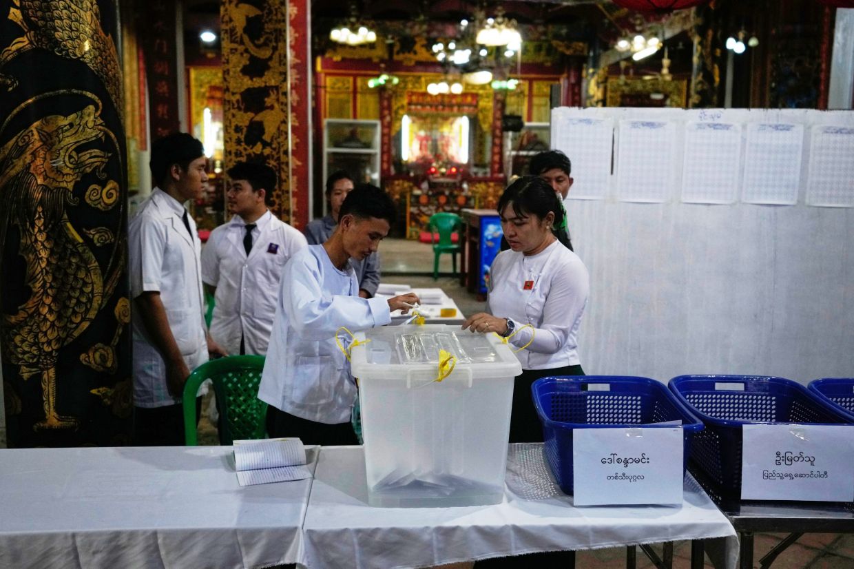 Officials of the Union Election Commission prepare to count ballots at a polling station during the second phase of the general election, in Yangon, Myanmar, Sunday, Jan. 11, 2026. -- AP Photo/Thein Zaw