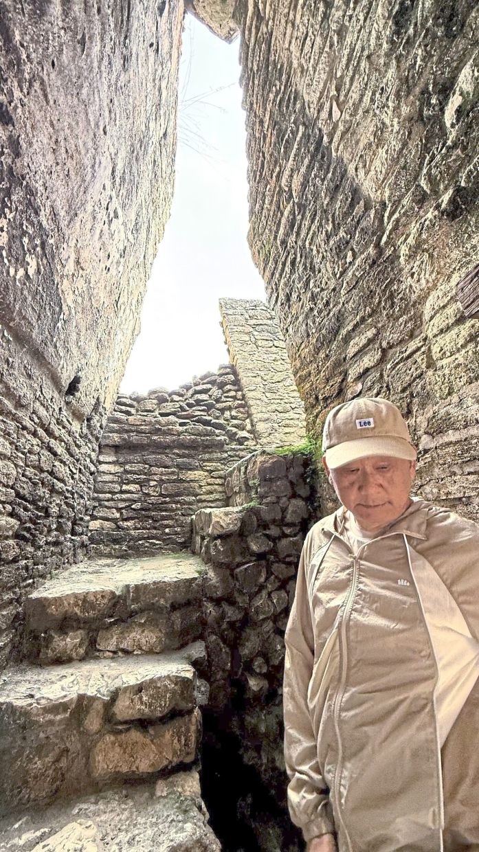 The writer at one of the many ancient Maya temples in Belize.