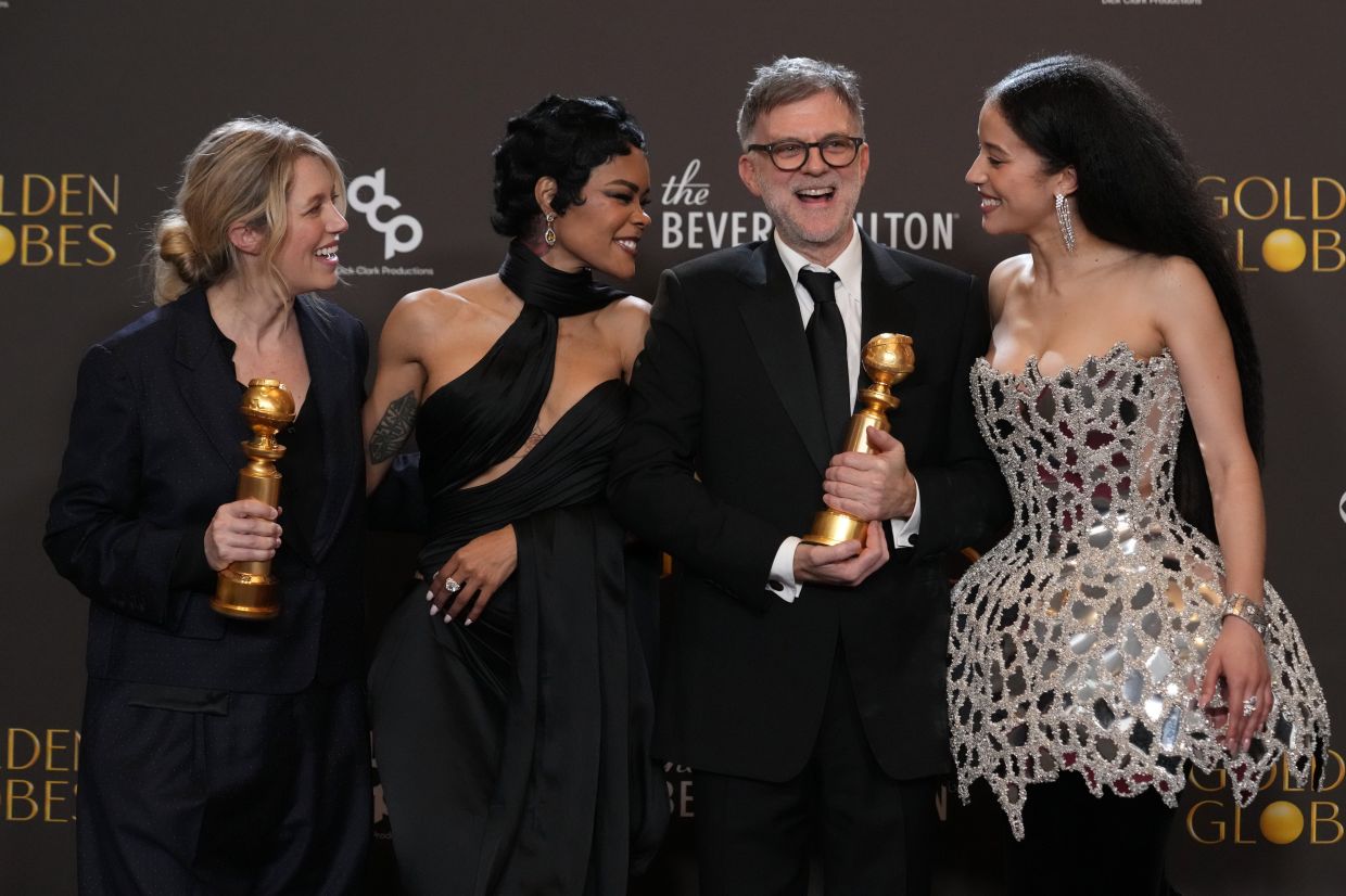 (From left) Sara Murphy, Teyana Taylor, Paul Thomas Anderson and Chase Infiniti pose in the press room with the award for best motion picture - musical or comedy for 'One Battle After Another' during the 83rd Golden Globes on Sunday, Jan 11, 2026, at the Beverly Hilton in Beverly Hills, Calif. Photo: AP