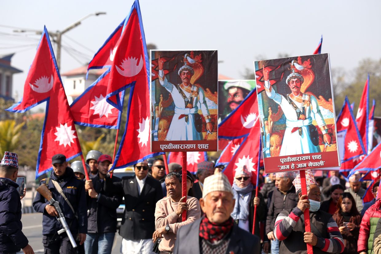 Supporters of Nepal's former royal family participating in a rally demanding the restoration of the monarchy as they mark the birth anniversary of the 18th century king Prithivi Narayan Shah, founder of the Shah dynasty, in Kathmandu on Jan 11, 2026. - AP
