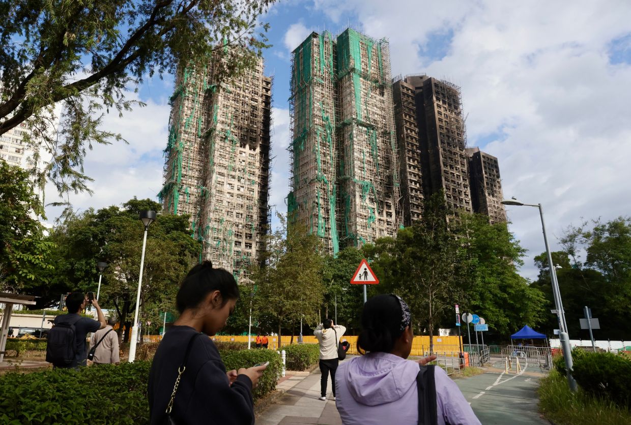 Hong Kong surveyor’s undeclared role prompts rule review after deadly Tai Po fire