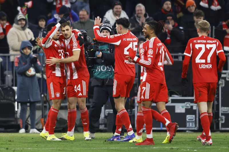 Soccer-Title race is far from over, Bayern bosses warn after big win