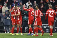 Soccer-Title race is far from over, Bayern bosses warn after big win